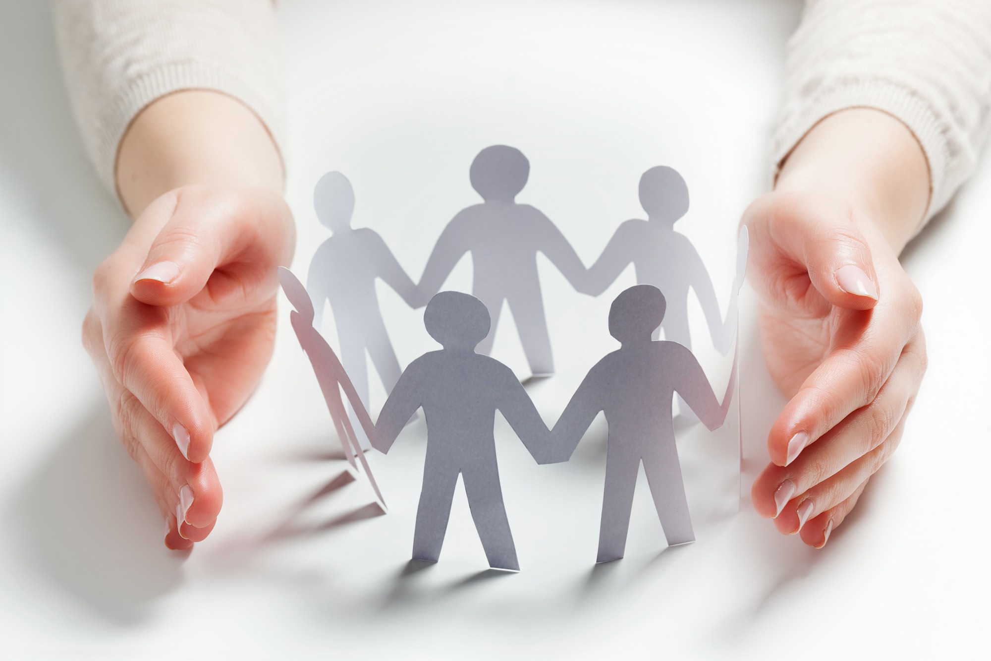 People Surrounded By Hands